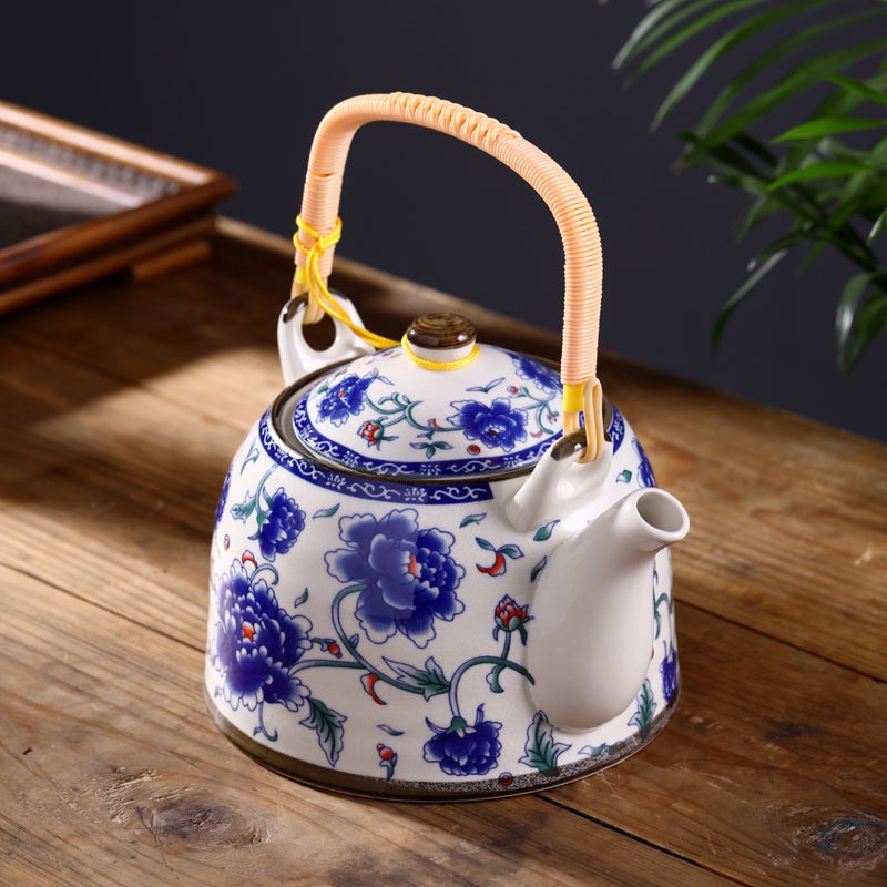 Blue and white Asian teapot with teacup