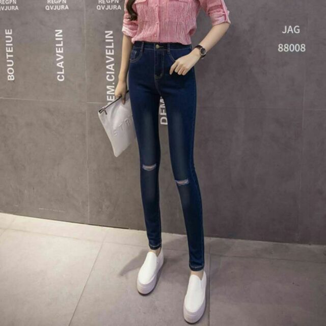 skinny jeans ripped at the knee