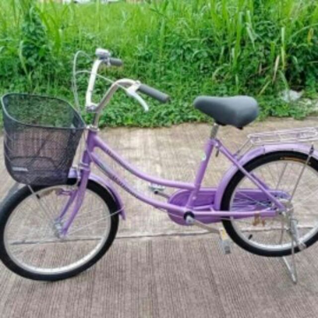 purple bike with basket