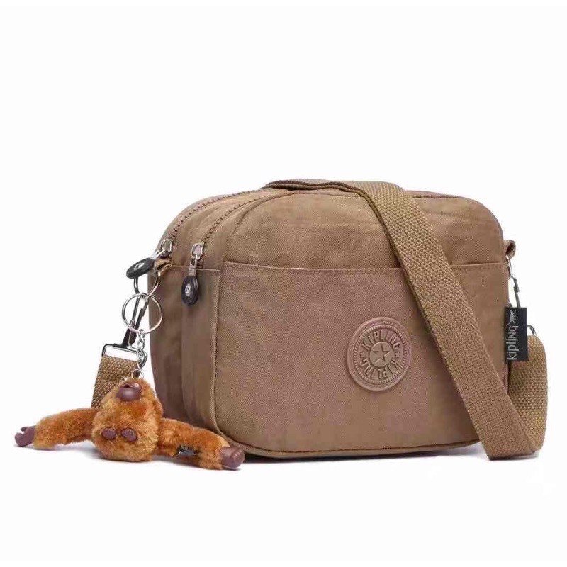 kipling sling bag original vs fake