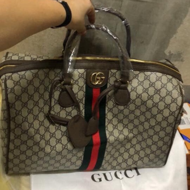 gucci luggage bag