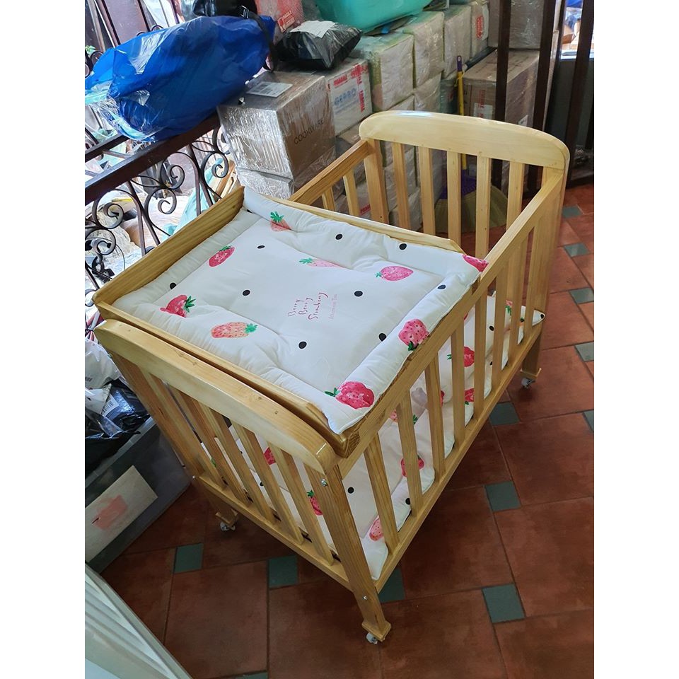 wooden crib with drawers