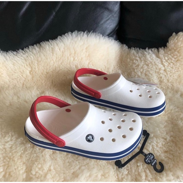 white crocs with blue stripe