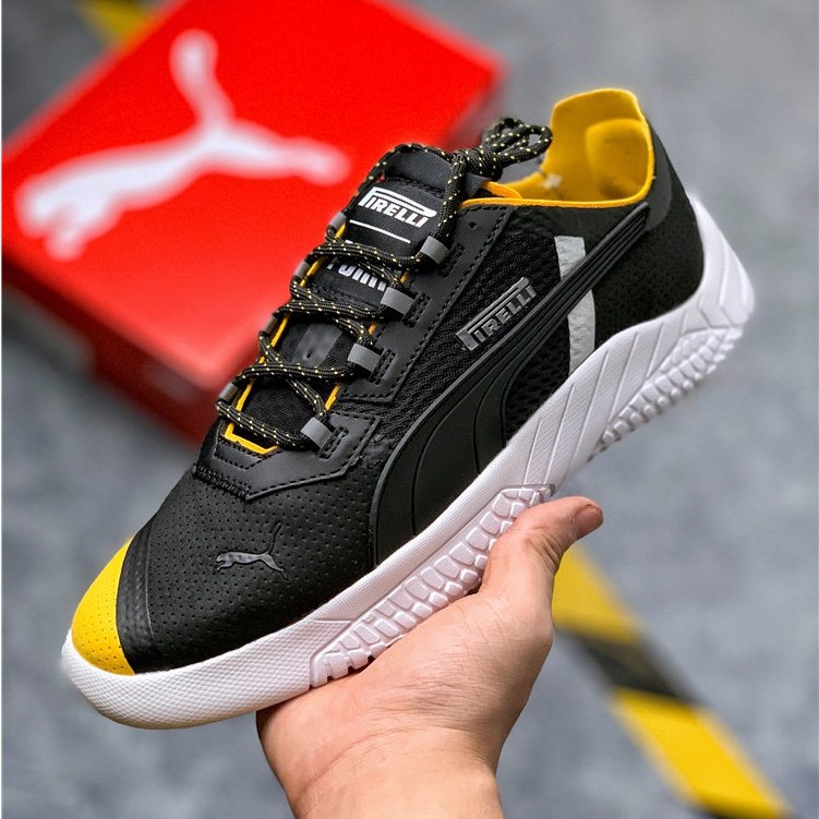black and yellow puma shoes