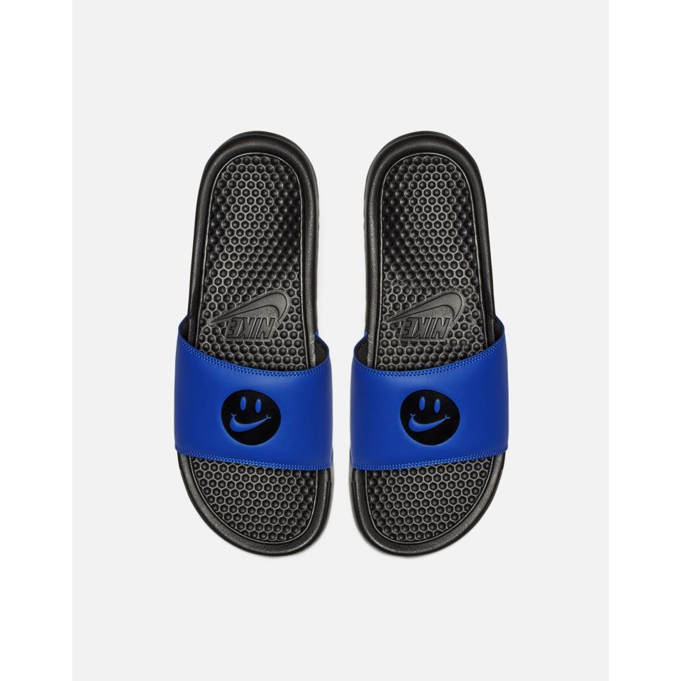 nike slides with smiley face