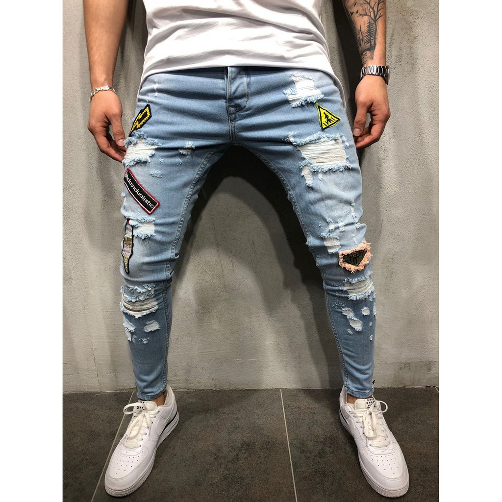 distressed patched jeans