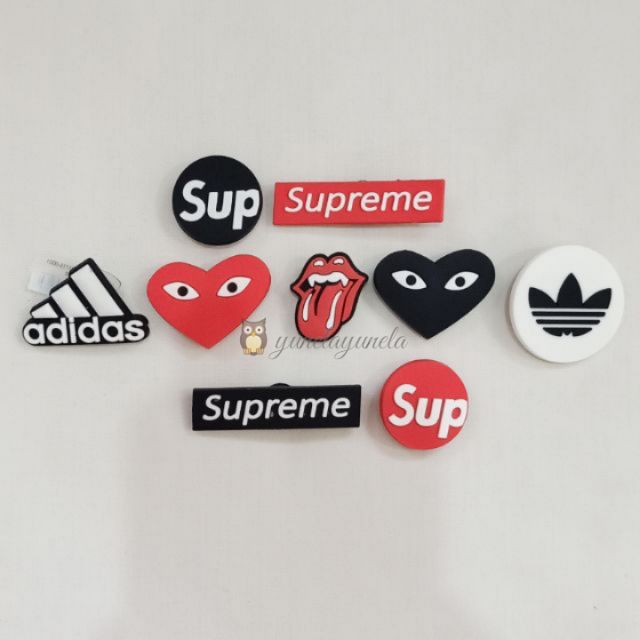 Supreme crocs charms online