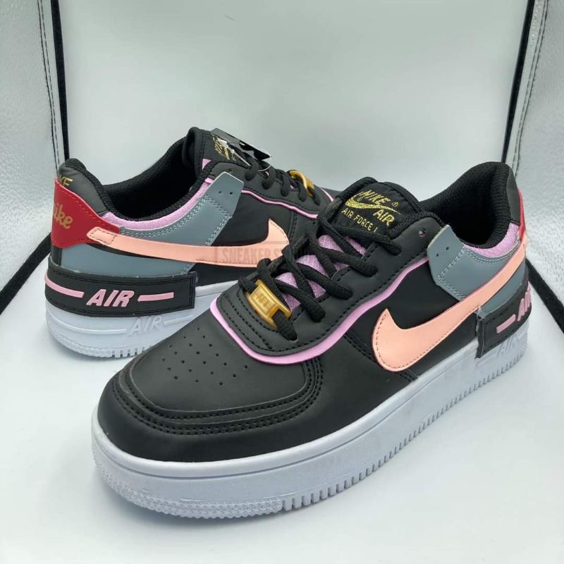 black and light pink nike shoes