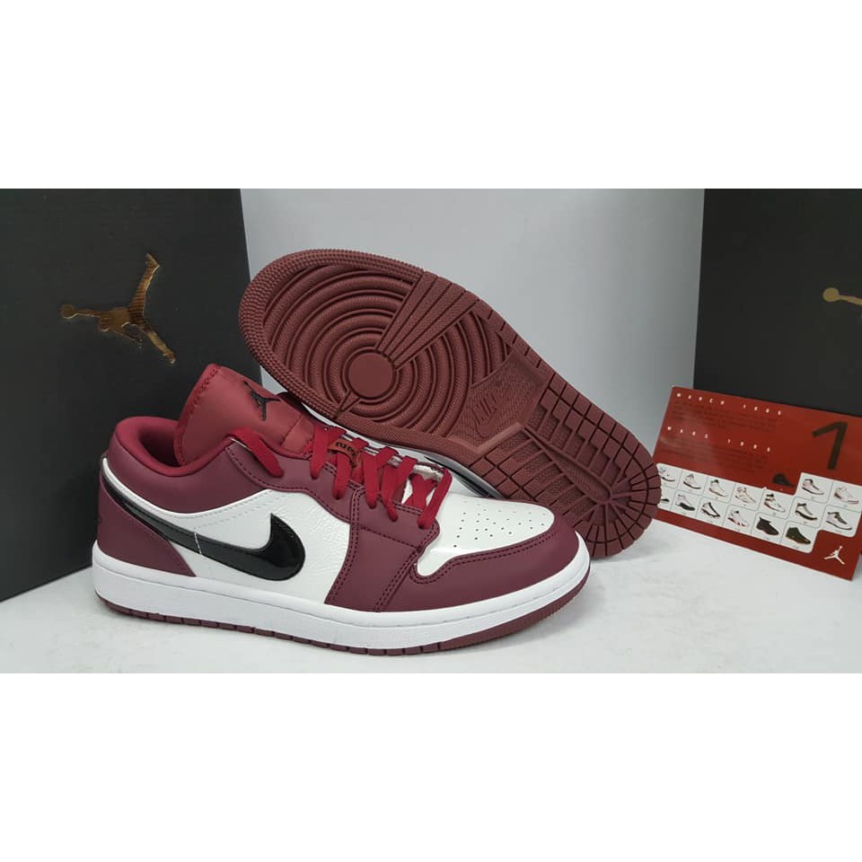 maroon and white tennis shoes