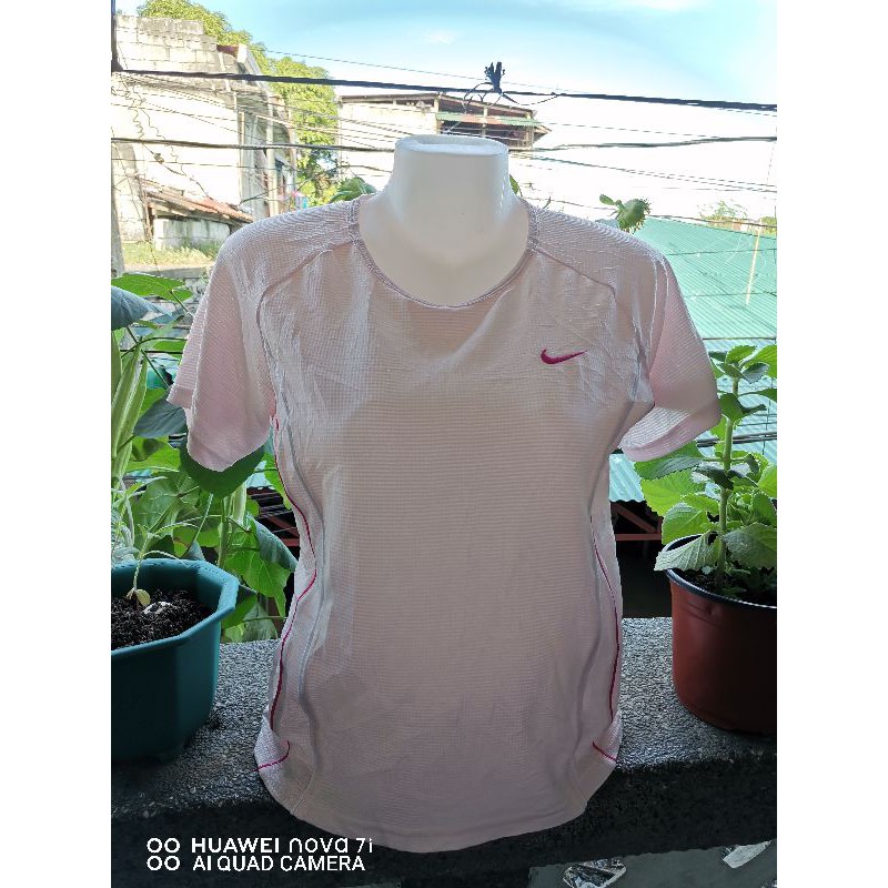 baby pink nike shirt
