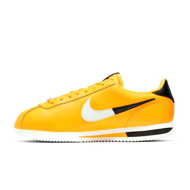 white and yellow nike cortez