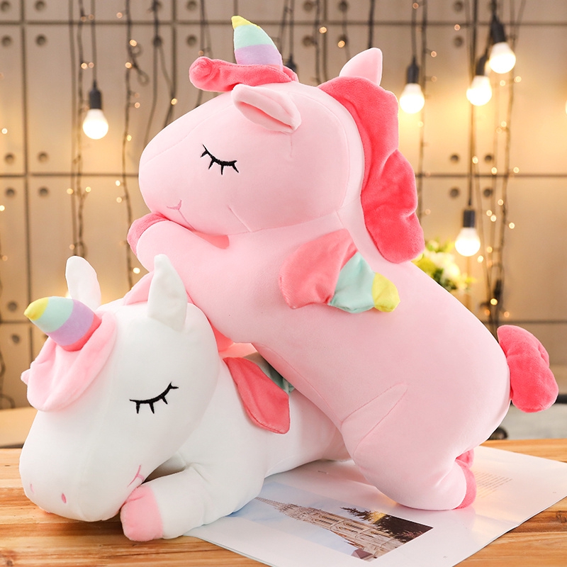 giant pink stuffed unicorn