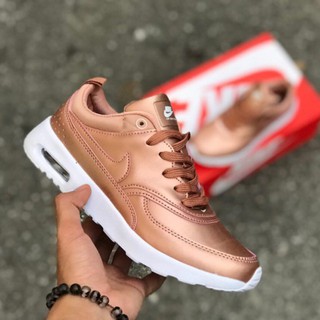 nike air thea rose gold