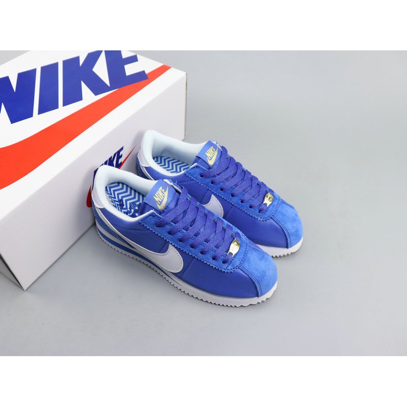 blue and white nike cortez