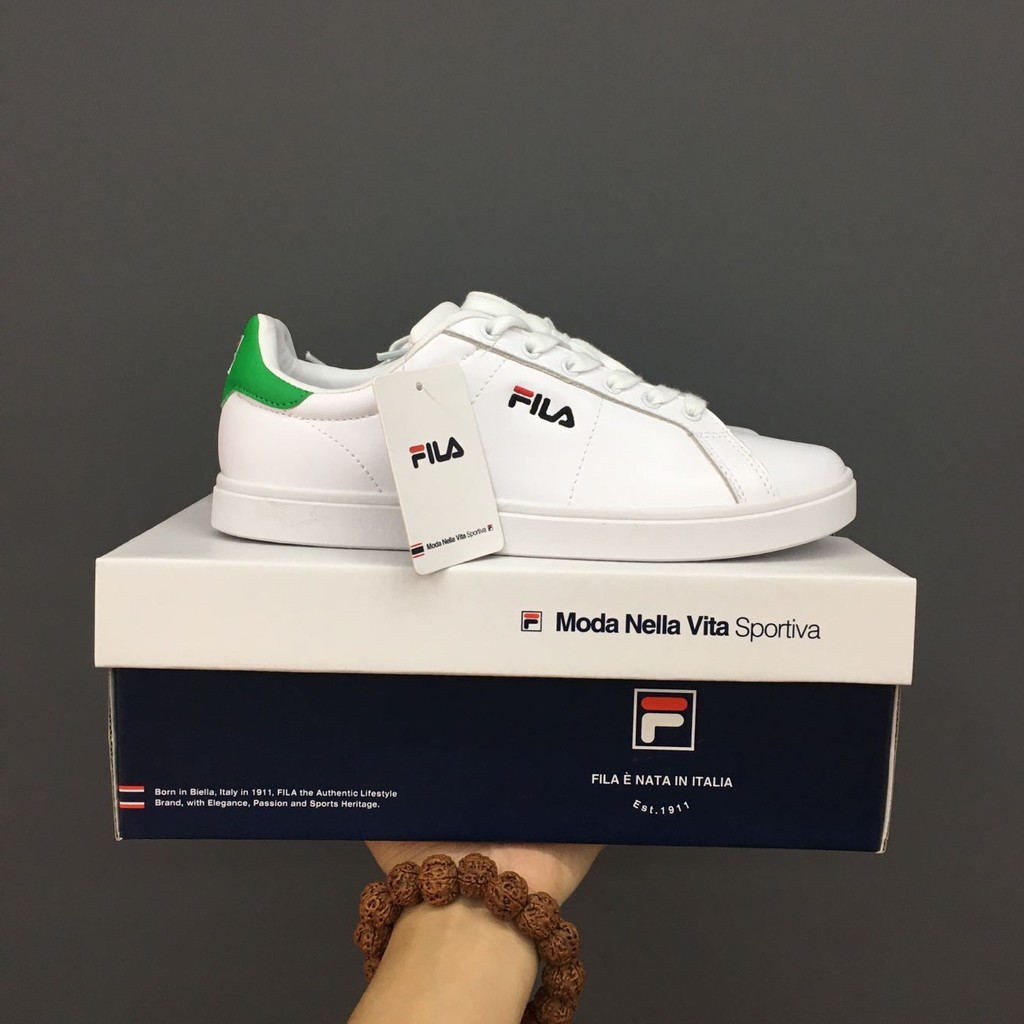 green and white fila shoes