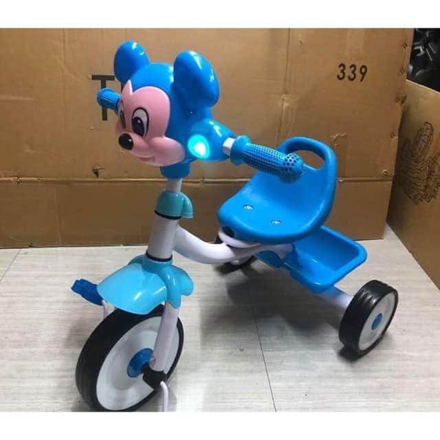 mickey mouse toy on bike