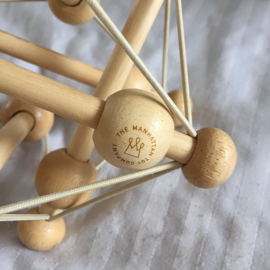 manhattan toy skwish natural rattle and teether grasping activity toy