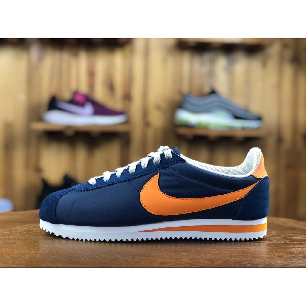 navy and white nike cortez