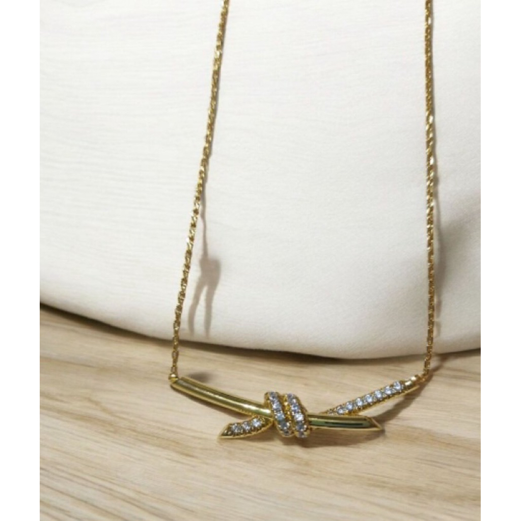 Diamond Knot Pendant Necklace | 18K Yellow Gold Setting | Elegant Minimalist Design product photo 1