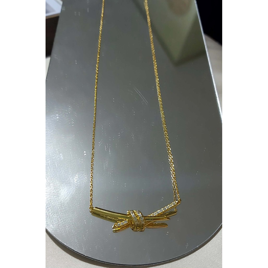 Diamond Knot Pendant Necklace | 18K Yellow Gold Setting | Elegant Minimalist Design product photo 4
