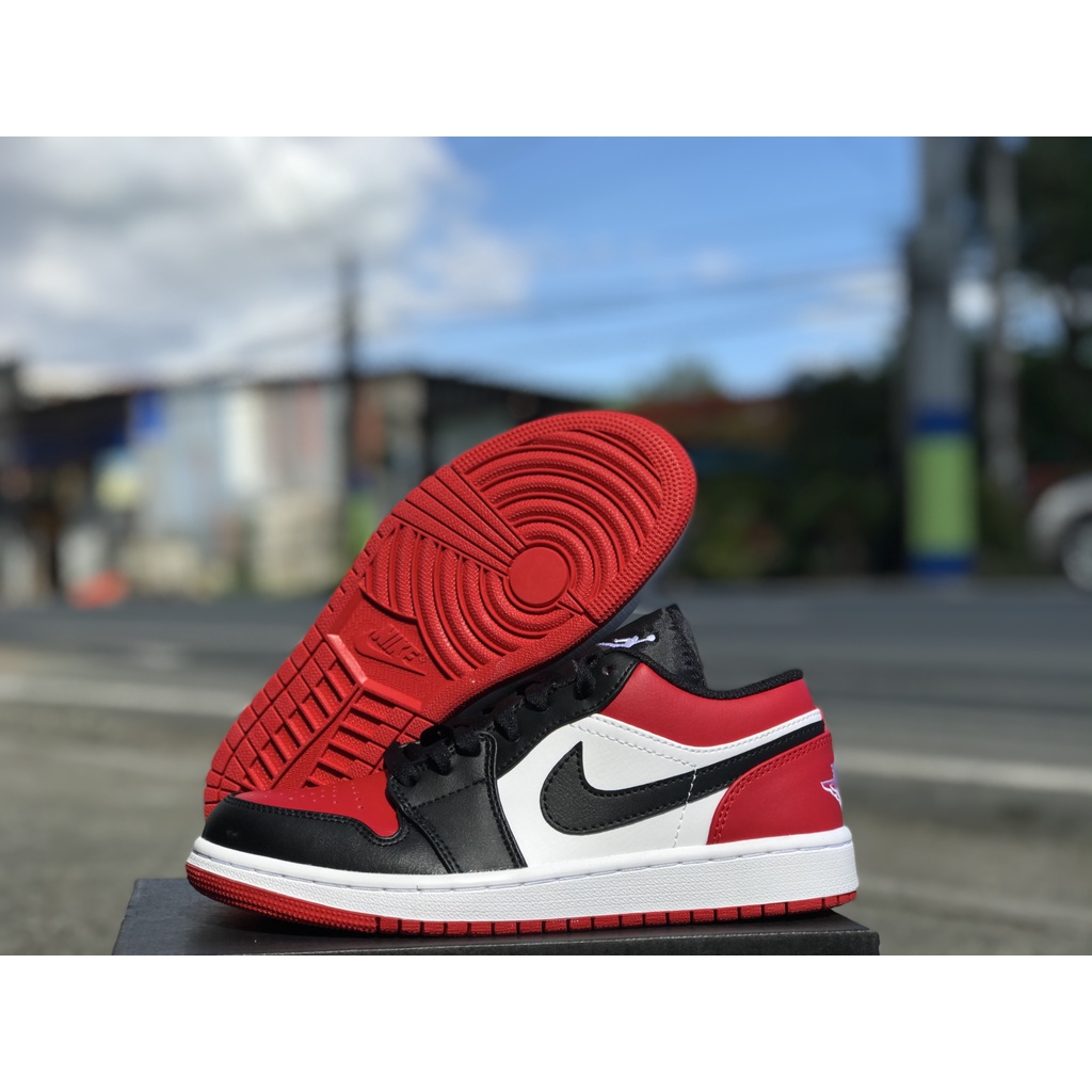 jordan 1 low red on feet